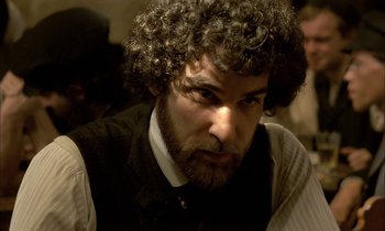 Movie still from “Yentl” (1983), directed by Barbra Streisand – A person with a beard; Close Up shot, Over the shoulder angle