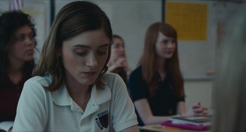 Movie still from “Yes, God, Yes” (2019), directed by Karen Maine – A group of people sitting in a room; Close Up shot, Over the shoulder angle
