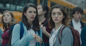 Movie still from “Yes, God, Yes” (2019), directed by Karen Maine – A group of young women standing next to each other; Close Up shot, Over the shoulder angle