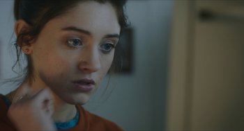 Movie still from “Yes, God, Yes” (2019), directed by Karen Maine – A person looking at a mirror; Close Up shot, Over the shoulder angle