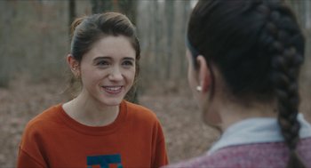 Movie still from “Yes, God, Yes” (2019), directed by Karen Maine – Two women talking to each other in the woods; Close Up shot, Over the shoulder angle