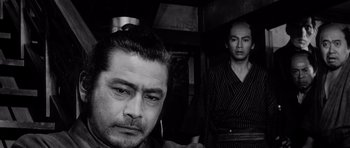 Movie still from “Yojimbo” (1961), directed by Akira Kurosawa – A man in a robe and a man in a kimono; Close Up shot, Low angle