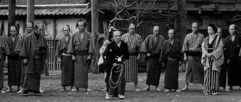 Movie still from “Yojimbo” (1961), directed by Akira Kurosawa – A group of men standing next to each other; Wide shot, Low angle