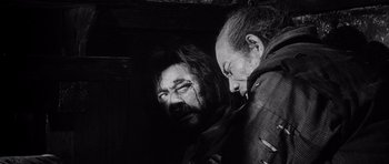 Movie still from “Yojimbo” (1961), directed by Akira Kurosawa – A man and a woman are looking at one another; Close Up shot, High angle