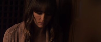 Movie still from “You're Next” (2011), directed by Adam Wingard – A person with long brown hair; Close Up shot, High angle