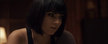 Movie still from “You're Next” (2011), directed by Adam Wingard – A person with short black hair; Close Up shot, High angle