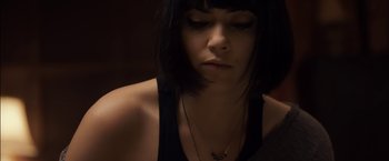 Movie still from “You're Next” (2011), directed by Adam Wingard – A person wearing a black tank top; Close Up shot, Low angle