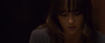 Movie still from “You're Next” (2011), directed by Adam Wingard – A person with long brown hair; Close Up shot, High angle