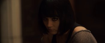 Movie still from “You're Next” (2011), directed by Adam Wingard – A person with short black hair; Close Up shot, High angle