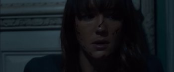 Movie still from “You're Next” (2011), directed by Adam Wingard – A person with blood all over their face; Close Up shot, Low angle