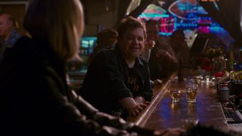 Movie still from “Young Adult” (2011), directed by Jason Reitman – A group of people sitting at a bar drinking; Medium shot, Over the shoulder angle