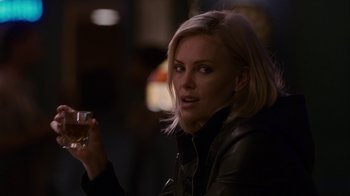 Movie still from “Young Adult” (2011), directed by Jason Reitman – A woman holding a drink in her right hand; Close Up shot, Over the shoulder angle