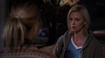 Movie still from “Young Adult” (2011), directed by Jason Reitman – Two women are talking to each other in a dark room; Close Up shot, Over the shoulder angle