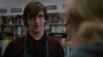 Movie still from “Young Adult” (2011), directed by Jason Reitman – A man wearing glasses talking to a woman; Close Up shot, Over the shoulder angle