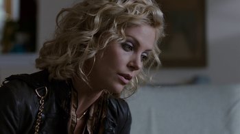 Movie still from “Young Adult” (2011), directed by Jason Reitman – A woman with blonde curly hair wearing a leather jacket; Close Up shot, Over the shoulder angle