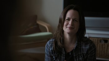 Movie still from “Young Adult” (2011), directed by Jason Reitman – A person sitting in a room; Close Up shot, Over the shoulder angle