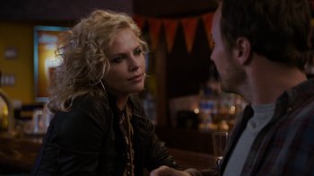 Movie still from “Young Adult” (2011), directed by Jason Reitman – A woman sitting at a table talking to a man; Close Up shot, Over the shoulder angle