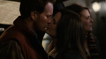Movie still from “Young Adult” (2011), directed by Jason Reitman – A man and a woman kissing each other in the dark; Close Up shot, Over the shoulder angle