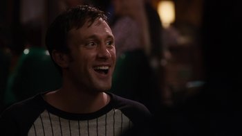 Movie still from “Young Adult” (2011), directed by Jason Reitman – A person smiling with his mouth wide open; Close Up shot, Over the shoulder angle