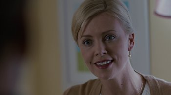 Movie still from “Young Adult” (2011), directed by Jason Reitman – A person smiling for the camera; Close Up shot, Over the shoulder angle