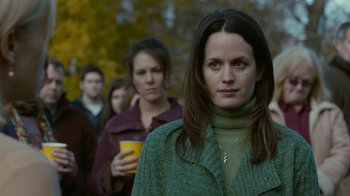 Movie still from “Young Adult” (2011), directed by Jason Reitman – A group of people standing next to each other on a sidewalk; Close Up shot, Over the shoulder angle