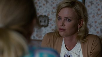 Movie still from “Young Adult” (2011), directed by Jason Reitman – A woman sitting in front of another woman in front of a mirror; Close Up shot, Over the shoulder angle