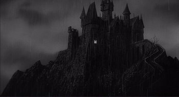 Movie still from “Young Frankenstein” (1974), directed by Mel Brooks – A castle with a light shining on it's side; Extreme Wide shot, Low angle