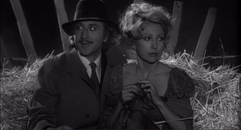 Movie still from “Young Frankenstein” (1974), directed by Mel Brooks – A man and a woman are posing for a picture; Medium shot, High angle