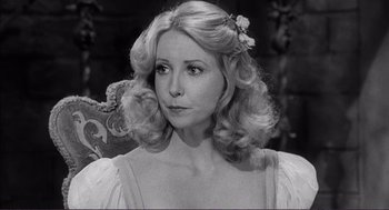 Movie still from “Young Frankenstein” (1974), directed by Mel Brooks – A black and white photo of a woman with a flower in her hair; Close Up shot, High angle