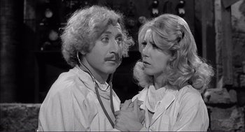 Movie still from “Young Frankenstein” (1974), directed by Mel Brooks – A man and a woman are looking at each other; Close Up shot, Low angle