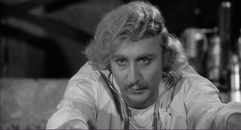 Movie still from “Young Frankenstein” (1974), directed by Mel Brooks – A person wearing a stethoscope; Close Up shot, Over the shoulder angle