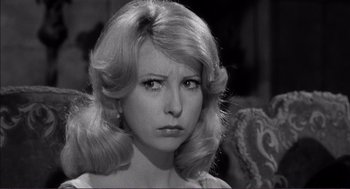 Movie still from “Young Frankenstein” (1974), directed by Mel Brooks – A black and white photo of a woman with long blonde hair; Close Up shot, Over the shoulder angle