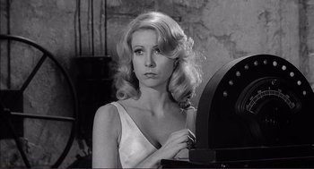 Movie still from “Young Frankenstein” (1974), directed by Mel Brooks – A black - and - white photo of a woman looking at the camera; Close Up shot, Low angle