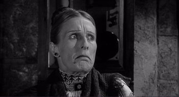 Movie still from “Young Frankenstein” (1974), directed by Mel Brooks – An older woman with a frowning look on her face; Close Up shot, Low angle