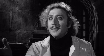 Movie still from “Young Frankenstein” (1974), directed by Mel Brooks – A man with a mustache is looking to his left; Close Up shot, Over the shoulder angle