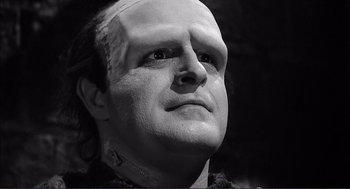 Movie still from “Young Frankenstein” (1974), directed by Mel Brooks – A person wearing a mask; Close Up shot, Low angle