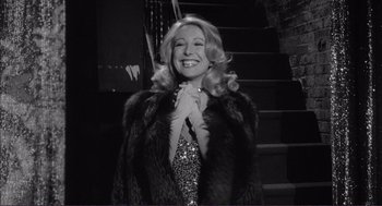 Movie still from “Young Frankenstein” (1974), directed by Mel Brooks – A black and white photo of a woman wearing a fur coat; Medium shot, Low angle