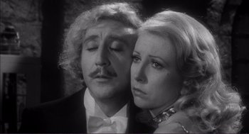Movie still from “Young Frankenstein” (1974), directed by Mel Brooks – A man and a woman in a black and white photo; Close Up shot, Low angle