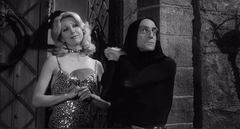 Movie still from “Young Frankenstein” (1974), directed by Mel Brooks – A man and a woman dressed up in costume; Medium shot, Low angle