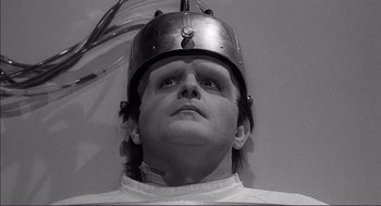 Movie still from “Young Frankenstein” (1974), directed by Mel Brooks – A man wearing a helmet looking up into the sky; Close Up shot, Low angle