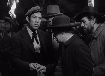 Movie still from “Young Mr. Lincoln” (1939), directed by John Ford – A group of men standing next to each other; Medium shot, Low angle