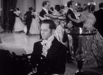 Movie still from “Young Mr. Lincoln” (1939), directed by John Ford – A black and white photo of a man in a suit and tie; Medium shot, High angle