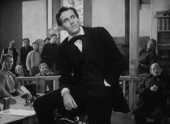 Movie still from “Young Mr. Lincoln” (1939), directed by John Ford – A black and white photo of a man in a suit; Medium shot, Low angle