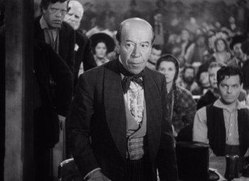 Movie still from “Young Mr. Lincoln” (1939), directed by John Ford – An older man standing in front of an audience; Medium shot, Low angle