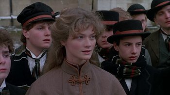 Movie still from “Young Sherlock Holmes” (1985), directed by Barry Levinson – A group of young people standing next to each other; Close Up shot, Over the shoulder angle