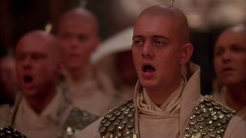 Movie still from “Young Sherlock Holmes” (1985), directed by Barry Levinson – A man with bald hair and a bald head is looking surprised; Close Up shot, Low angle