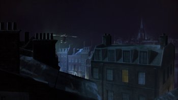 Movie still from “Young Sherlock Holmes” (1985), directed by Barry Levinson – A view of a city at night from a window; Extreme Wide shot, Low angle