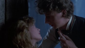 Movie still from “Young Sherlock Holmes” (1985), directed by Barry Levinson – A man and a woman face to face in a dark room; Close Up shot, Low angle