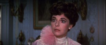 Movie still from “Young Winston” (1972), directed by Richard Attenborough – A person wearing a dress; Close Up shot, Over the shoulder angle