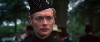 Movie still from “Young Winston” (1972), directed by Richard Attenborough – A person wearing a hat; Close Up shot, High angle